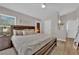 Bedroom with a dark wood bed frame, two nightstands, and ensuite bathroom at 4244 Totano Dr, North Las Vegas, NV 89032