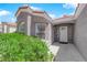 Close up of the front entrance of the home with tidy landscaping at 4244 Totano Dr, North Las Vegas, NV 89032