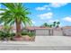 Charming single story home with desert landscaping, palm trees, and a two car garage at 4244 Totano Dr, North Las Vegas, NV 89032