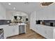 Bright kitchen features white cabinets, stainless steel appliances, and an open concept living area at 4244 Totano Dr, North Las Vegas, NV 89032