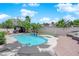 Backyard pool with bar and seating area with lush landscaping, creating a private oasis at 4244 Totano Dr, North Las Vegas, NV 89032