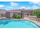 Backyard pool with patio seating, perfect for relaxation and outdoor entertaining near lush landscaping at 4244 Totano Dr, North Las Vegas, NV 89032
