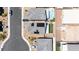 Modern home equipped with solar panels, with a backyard designed for outdoor living at 438 Shimmering Sands Ave, North Las Vegas, NV 89031