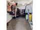 Walk-in closet with shelving for storage of clothes, shoes, and accessories. Includes carpeted flooring at 438 Shimmering Sands Ave, North Las Vegas, NV 89031