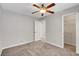 Bedroom featuring neutral walls, carpeted flooring, a ceiling fan, and a closet at 4905 Ocean Shores Way, Las Vegas, NV 89130