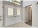 Bright and spacious foyer featuring white tile floors and a high ceiling at 4905 Ocean Shores Way, Las Vegas, NV 89130