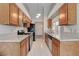 Galley kitchen with stainless steel appliances and lots of counter space at 4905 Ocean Shores Way, Las Vegas, NV 89130