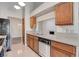 This kitchen features a dishwasher, stainless steel sink and fixtures and wood cabinetry at 4905 Ocean Shores Way, Las Vegas, NV 89130