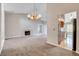 Open living room with fireplace view to the kitchen at 4905 Ocean Shores Way, Las Vegas, NV 89130