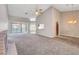 Spacious living room with vaulted ceiling, fireplace, and sliding door access to the backyard at 4905 Ocean Shores Way, Las Vegas, NV 89130