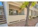 Balcony on the ground level with access to exterior stairs and a view of the building at 4955 Lindell Rd # 130, Las Vegas, NV 89118