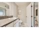 Bathroom features granite countertops, white cabinetry, and tile floors at 4955 Lindell Rd # 130, Las Vegas, NV 89118