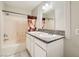 Bathroom with a tub and a granite double sink at 4955 Lindell Rd # 130, Las Vegas, NV 89118