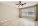 Bedroom boasts wood-look floors, neutral walls, large window and is brightly illuminated by natural light at 4955 Lindell Rd # 130, Las Vegas, NV 89118