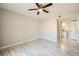Bedroom features wood-look floors, ceiling fan, and an ensuite bathroom for added privacy and convenience at 4955 Lindell Rd # 130, Las Vegas, NV 89118