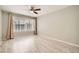 Bedroom offering neutral paint, wood-look floors and window with curtains and blinds at 4955 Lindell Rd # 130, Las Vegas, NV 89118