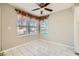 Bright breakfast nook with ceramic tile flooring and a ceiling fan for added comfort at 4955 Lindell Rd # 130, Las Vegas, NV 89118