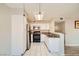 Well-lit kitchen featuring stainless steel appliances, white cabinets, and granite countertops at 4955 Lindell Rd # 130, Las Vegas, NV 89118