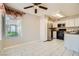 Bright kitchen with stainless steel appliances, white cabinets, and a window letting in natural light at 4955 Lindell Rd # 130, Las Vegas, NV 89118