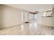 Spacious living room boasts wood-look floors and an open layout to the kitchen at 4955 Lindell Rd # 130, Las Vegas, NV 89118