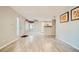 Bright, open living space with wood-look floors and seamless flow to kitchen at 4955 Lindell Rd # 130, Las Vegas, NV 89118