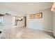 Open-concept living area featuring stainless steel kitchen appliances and wood-look floors at 4955 Lindell Rd # 130, Las Vegas, NV 89118