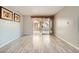 Open living room featuring wood-look floors and access to outdoor living space at 4955 Lindell Rd # 130, Las Vegas, NV 89118