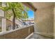 Cozy patio with textured walls and views of the community parking area at 4955 Lindell Rd # 130, Las Vegas, NV 89118