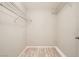 Walk-in closet featuring wood-look flooring and wire shelving for organizing and storing wardrobe at 4955 Lindell Rd # 130, Las Vegas, NV 89118