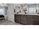 Well-lit bathroom includes a double vanity, granite countertops, and ample storage at 5234 Savannah Rose St, Las Vegas, NV 89149