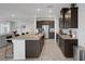 Bright kitchen with stainless steel appliances, granite countertops, and a large kitchen island at 5234 Savannah Rose St, Las Vegas, NV 89149