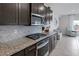 Modern kitchen with stainless steel oven and granite counters; bright space at 5234 Savannah Rose St, Las Vegas, NV 89149