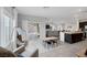 Open-concept with a comfortable seating area, direct access to the backyard, and a view of the kitchen at 5234 Savannah Rose St, Las Vegas, NV 89149