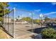 Community basketball court featuring a chainlink fence and mature trees nearby at 5439 Bradford Pear Dr, Las Vegas, NV 89122