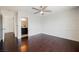 Spacious primary bedroom boasts hardwood floors, a ceiling fan, and a paneled accent wall at 5439 Bradford Pear Dr, Las Vegas, NV 89122