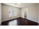 Bedroom with wood floors, bright light, and an adjoining bathroom with tiled shower at 5439 Bradford Pear Dr, Las Vegas, NV 89122