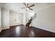 Open concept living room boasts hardwood floors and staircase leading to the second floor at 5439 Bradford Pear Dr, Las Vegas, NV 89122