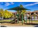 Neighborhood playground with slides, climbing structures, and mature trees for shade at 5439 Bradford Pear Dr, Las Vegas, NV 89122