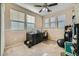 Bedroom with neutral walls, multiple windows, carpeted floors, and a ceiling fan with lighting at 5442 Bristol Bend Ct, Las Vegas, NV 89135