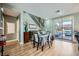 An inviting dining area features wood floors and sliding glass doors to the outdoor pool area at 5442 Bristol Bend Ct, Las Vegas, NV 89135