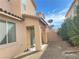 Backyard with plants, block wall, patio, and sliding glass door at 5513 Silent Springs Dr, Las Vegas, NV 89122