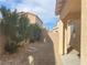Backyard with plants, block wall, and a covered patio at 5513 Silent Springs Dr, Las Vegas, NV 89122