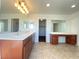 Bathroom featuring double sinks with a vanity area and tile floors at 5513 Silent Springs Dr, Las Vegas, NV 89122
