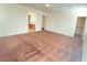 Bedroom featuring carpeted floors and natural light, seamlessly leading to bathroom and closet at 5513 Silent Springs Dr, Las Vegas, NV 89122