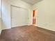 Bedroom featuring carpet, closet and adjoining doorway to another room at 5513 Silent Springs Dr, Las Vegas, NV 89122