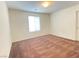Spacious bedroom with neutral walls, carpeted floor, and a window letting in natural light at 5513 Silent Springs Dr, Las Vegas, NV 89122