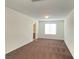 Bedroom featuring carpet, window with blinds and adjoining doorway to bathroom at 5513 Silent Springs Dr, Las Vegas, NV 89122