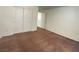 Bedroom with carpeted floor, white walls, double-door closet providing ample storage at 5513 Silent Springs Dr, Las Vegas, NV 89122