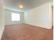 Bedroom featuring carpet, window with blinds and adjoining doorway at 5513 Silent Springs Dr, Las Vegas, NV 89122