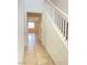 Home entryway featuring tile floors and a staircase at 5513 Silent Springs Dr, Las Vegas, NV 89122